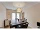 Cozy dining room featuring a dark wood table, chairs, and a chandelier at 3570 Keels Ln, Atlanta, GA 30349