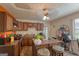 Kitchen featuring wooden cabinetry, an island with seating, and a view of the room's layout at 3570 Keels Ln, Atlanta, GA 30349