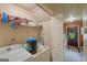 Functional laundry room with washer, dryer, and built-in shelving for storage at 3570 Keels Ln, Atlanta, GA 30349