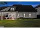 Large backyard with a covered patio and outdoor seating, perfect for entertaining at 1102 Maybeck Way, Peachtree City, GA 30269