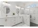 Contemporary bathroom with dual sinks, gold fixtures, and a glass shower featuring classic marble tile at 1102 Maybeck Way, Peachtree City, GA 30269
