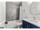 Bathroom features tiled walls, shower-tub combo, and a vanity with sink at 1102 Maybeck Way, Peachtree City, GA 30269