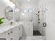 Stylish bathroom with a marble-tiled shower, double vanity, gold fixtures, and natural light at 1102 Maybeck Way, Peachtree City, GA 30269