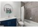Charming bathroom features a navy blue vanity with white countertop and a shower with gray tiles at 1102 Maybeck Way, Peachtree City, GA 30269