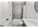 Bathroom features tiled walls, shower-tub combo, and a vanity with sink at 1102 Maybeck Way, Peachtree City, GA 30269