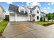 Beautiful modern farmhouse with a two-car garage and manicured lawn at 1102 Maybeck Way, Peachtree City, GA 30269