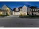 Attractive two-story home with a two-car garage and a well-maintained front yard at night at 1102 Maybeck Way, Peachtree City, GA 30269