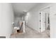 Hallway on upper level with carpeted floors and a view of the stairs at 1102 Maybeck Way, Peachtree City, GA 30269