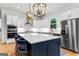 Contemporary kitchen with a spacious island, stainless steel appliances, and white cabinetry for a sleek design at 1102 Maybeck Way, Peachtree City, GA 30269
