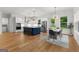 Spacious open concept kitchen and dining area filled with natural light and features modern appliances and a stylish island at 1102 Maybeck Way, Peachtree City, GA 30269