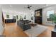 Bright living room with hardwood floors, fireplace and an open view of the kitchen and dining area at 1102 Maybeck Way, Peachtree City, GA 30269
