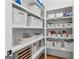 Well-organized pantry with white shelving and baskets, perfect for storage and keeping items easily accessible at 1102 Maybeck Way, Peachtree City, GA 30269