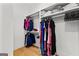 Spacious walk-in closet with custom shelving, hanging racks, and hardwood floors, perfect for organization at 1102 Maybeck Way, Peachtree City, GA 30269