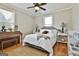 This organized bedroom includes a queen bed, neutral décor, and a stylish piano, offering both comfort and functionality at 395 W Mcintosh Rd, Brooks, GA 30205