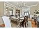 Spacious dining area showcasing hardwood floors, elegant furnishings, and an inviting atmosphere for gatherings at 395 W Mcintosh Rd, Brooks, GA 30205