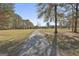 Picturesque property featuring a long driveway and stunning brick home at 395 W Mcintosh Rd, Brooks, GA 30205