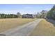 Beautiful brick home with a long driveway and expansive front yard at 395 W Mcintosh Rd, Brooks, GA 30205