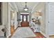 Welcoming foyer with hardwood flooring, stylish console table, and ample natural light creates an inviting atmosphere at 395 W Mcintosh Rd, Brooks, GA 30205