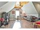 This game room offers a relaxed atmosphere with a vintage phone booth, comfortable seating, and ample space for entertainment at 395 W Mcintosh Rd, Brooks, GA 30205