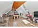 Spacious game room with pool table, foosball, and hardwood floors, perfect for entertaining at 395 W Mcintosh Rd, Brooks, GA 30205