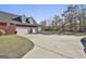 Spacious brick home features a three-car garage and ample parking space, perfect for convenience at 395 W Mcintosh Rd, Brooks, GA 30205