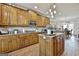 This kitchen features wood cabinets, granite countertops, and a central island, perfect for meal prep and entertaining at 395 W Mcintosh Rd, Brooks, GA 30205