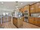 Spacious kitchen featuring stainless steel appliances, a center island, and ample cabinet space for efficient storage at 395 W Mcintosh Rd, Brooks, GA 30205