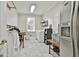 This laundry room is equipped with modern appliances, storage shelves, and ample workspace for efficient laundry care at 395 W Mcintosh Rd, Brooks, GA 30205
