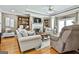 Cozy living room features built-in bookcases, a fireplace, and comfortable seating for relaxing or entertaining at 395 W Mcintosh Rd, Brooks, GA 30205