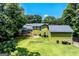 Aerial view of a home with a spacious backyard, deck, patio, and lush green lawn, perfect for outdoor living at 3778 Berdon Ln, Decatur, GA 30034