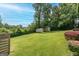 Large, green backyard with storage sheds, providing ample space for recreation and storage at 3778 Berdon Ln, Decatur, GA 30034