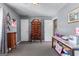 Bedroom with wall-to-wall carpet, an assortment of furniture, and a white-painted door at 3778 Berdon Ln, Decatur, GA 30034