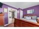 Bright bedroom with hardwood floors, natural lighting, and soft purple walls, creating a serene atmosphere at 3778 Berdon Ln, Decatur, GA 30034