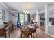 Elegant dining room featuring a classic chandelier, a wooden table, and decorative accents at 3778 Berdon Ln, Decatur, GA 30034