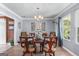 Elegant dining room featuring a classic chandelier, a wooden table, and decorative accents at 3778 Berdon Ln, Decatur, GA 30034