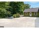 Spacious driveway leading to a well-maintained home with a white picket fence, offering ample parking at 3778 Berdon Ln, Decatur, GA 30034