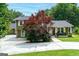 Charming home boasting mature trees, a manicured lawn, a covered porch, and a spacious driveway at 3778 Berdon Ln, Decatur, GA 30034