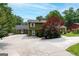 Charming two-story home featuring well-maintained landscaping, a spacious driveway, and a classic covered front porch at 3778 Berdon Ln, Decatur, GA 30034
