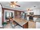 Bright kitchen with granite countertops, stainless appliances, and a view into the adjacent dining room at 3778 Berdon Ln, Decatur, GA 30034