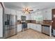 Bright kitchen featuring stainless steel appliances, ample cabinet space, and a tile backsplash at 3778 Berdon Ln, Decatur, GA 30034