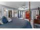 Spacious main bedroom with a four-poster bed and a view into the attached dressing room at 3778 Berdon Ln, Decatur, GA 30034