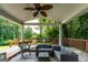Spacious covered patio with comfortable wicker furniture and a scenic view, perfect for entertaining at 3778 Berdon Ln, Decatur, GA 30034