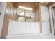 Bathroom featuring double sink vanity, custom mirror, lighting, and tile floors at 7392 N Mitchell Ct, Villa Rica, GA 30180