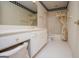Bathroom with vanity and a shower-tub combination and white tile flooring creating a comfortable and relaxing space at 7392 N Mitchell Ct, Villa Rica, GA 30180