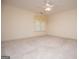 Sunlit bedroom with large window and ceiling fan offering comfort and ventilation for a restful night's sleep at 7392 N Mitchell Ct, Villa Rica, GA 30180