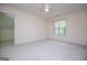 Bright and airy bedroom with a large window, providing natural light and a serene view of the outdoors at 7392 N Mitchell Ct, Villa Rica, GA 30180