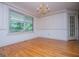 Bright dining room with chandelier and a large picture window at 7392 N Mitchell Ct, Villa Rica, GA 30180