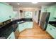 Charming kitchen with hardwood floors, modern appliances, and granite countertops at 7392 N Mitchell Ct, Villa Rica, GA 30180
