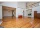 Open living room with hardwood floors and view of the adjoining dining room at 7392 N Mitchell Ct, Villa Rica, GA 30180