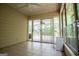 Light-filled sunroom with tile floors, sliding glass doors to the porch, and ample natural light at 7392 N Mitchell Ct, Villa Rica, GA 30180